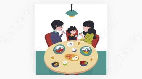 图片素材-坐在餐桌旁吃饭的家庭